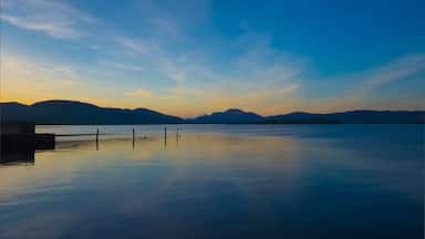 Loch Lomond sunset, the calm water of the famous scottish loch on a calm summer evening