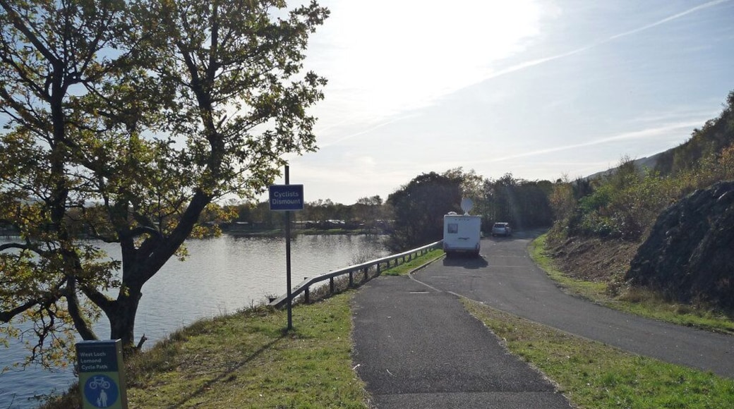 Cycle path near Inverbeg The West Loch Lomond cycle path joins a lay-by off the A82, occupied by several motor homes. The 'cyclists dismount' sign is patronising and pointless.