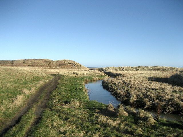 Embleton Burn Showing the small watercourse just before it enters the North Sea at Embleton Bay.