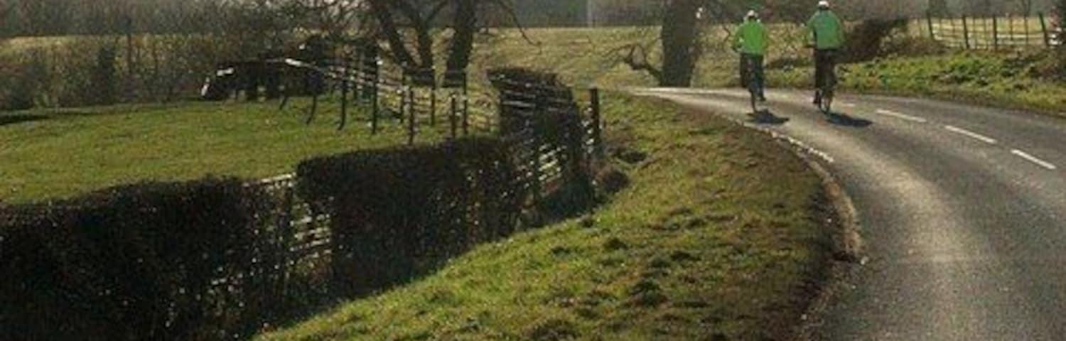 Cyclists Road from Glanton to Whittingham with the church in the distance.