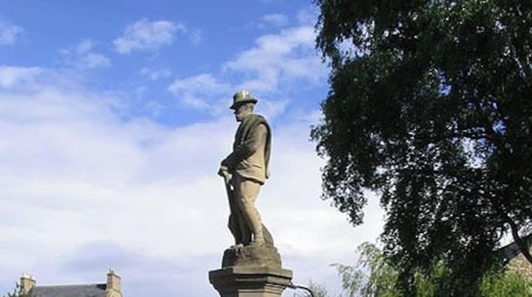 Fountain memorial in Whittingham A one time drinking fountain now filled in ready for bedding plants. Dedicated to the memory of the Third Earl of Ravensworth. There are four inscriptions at the base of the column as follows:- TO THE DEAR MEMORY OF ATHOLE THIRD EARL OF RAVENSWORTH HE SHALL FEED ME IN A GREEN PASTURE AND LEAD ME FORTH BESIDE THE WATERS OF COMFORT PS X111.11 ERECTED BY HIS WIFE CAROLINE COUNTESS OF RAVENSWORTH THE LORD IS MY SHEPHERD I SHALL NOT WANT PS. XX111.1