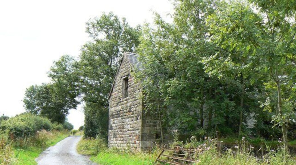 Abandoned barn A substantial stone building which appears to have fallen out of use and been left derelict.