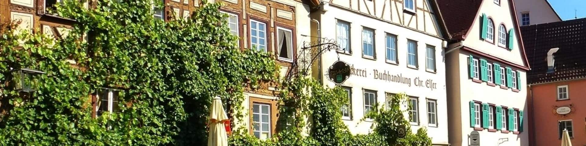 A row of traditional half-timbered buildings with a sign for 'Buchhandlung Chr. Else'.