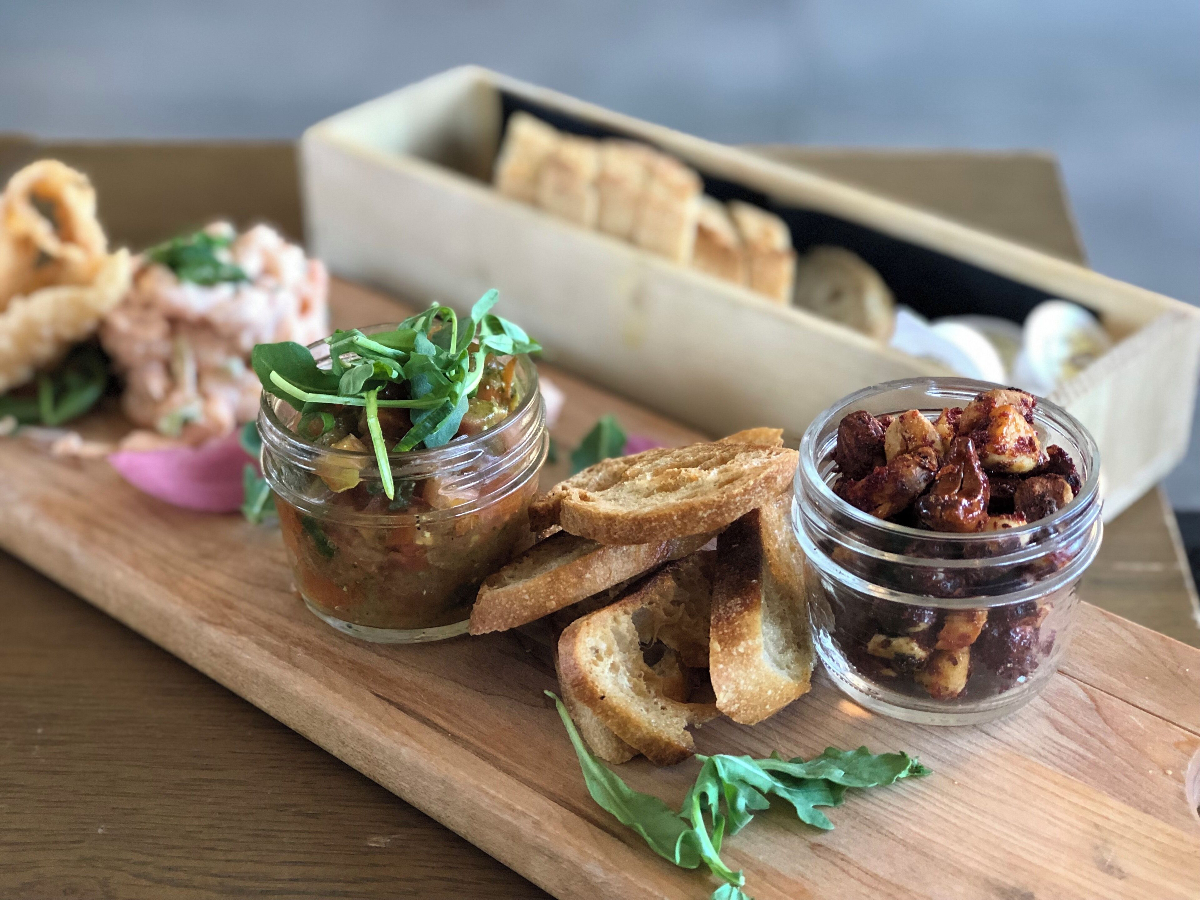 Scrumptious tapas at Le Bercail in Baie-Saint-Paul. One of two restaurants at Le Germain Hotel & Spa Charlevoix. Spiced nuts, shrimp with spicy mayonnaise and basil pesto bruschetta. A perfect little snack.