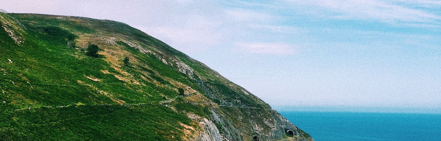 Walking from Bray to Greystones is the perfect hike to see those Irish cliffs you've always dreamed of. Can you imagine riding the train through here?! #adventure