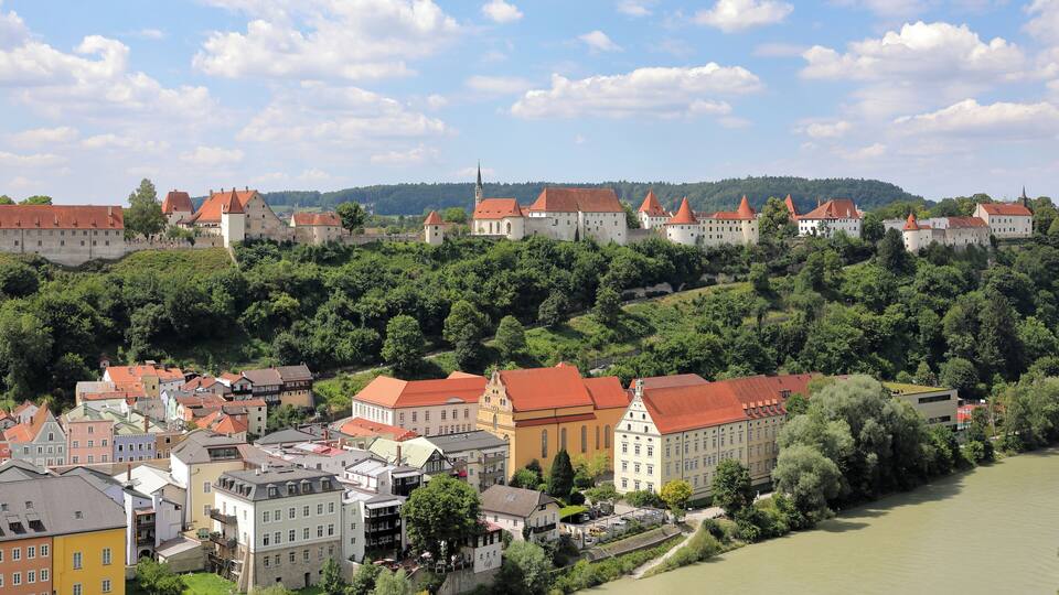 A town with historic buildings and a river.
