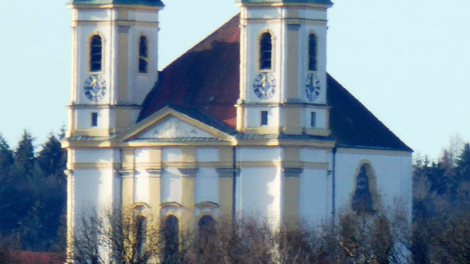 A church with two towers and a clock on each tower.