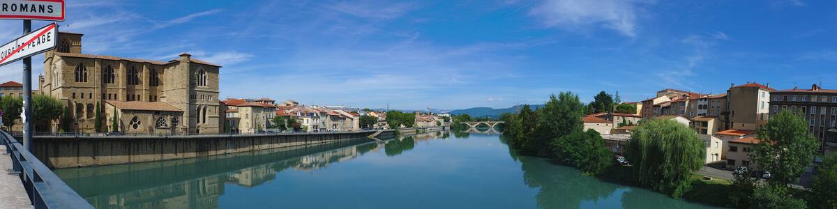 Panoramic view of the Isere river on the Old Bridge connecting Romans-sur-Isere to Bourg de Peage