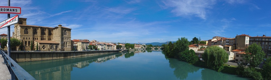 Panoramic view of the Isere river on the Old Bridge connecting Romans-sur-Isere to Bourg de Peage