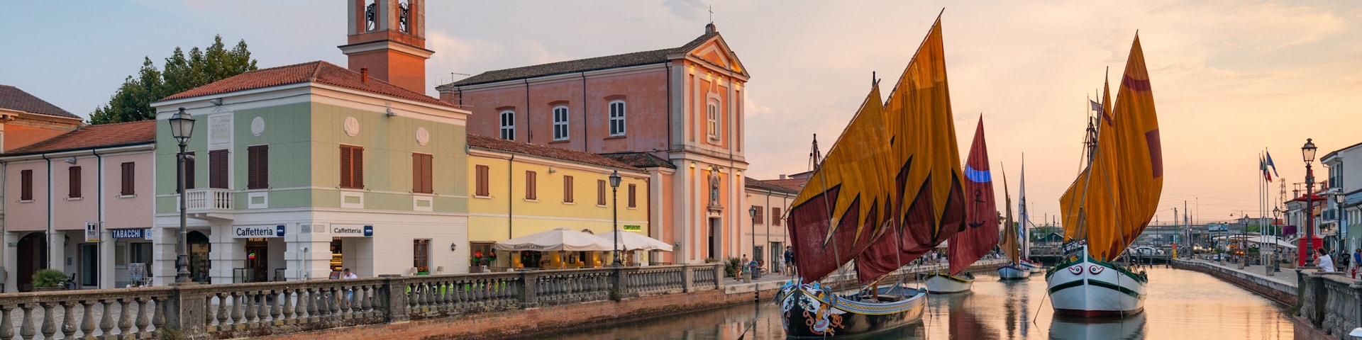 Cesenatico which includes a sunset and a bay or harbor