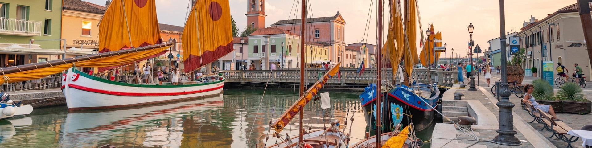 Cesenatico showing a sunset and a bay or harbor