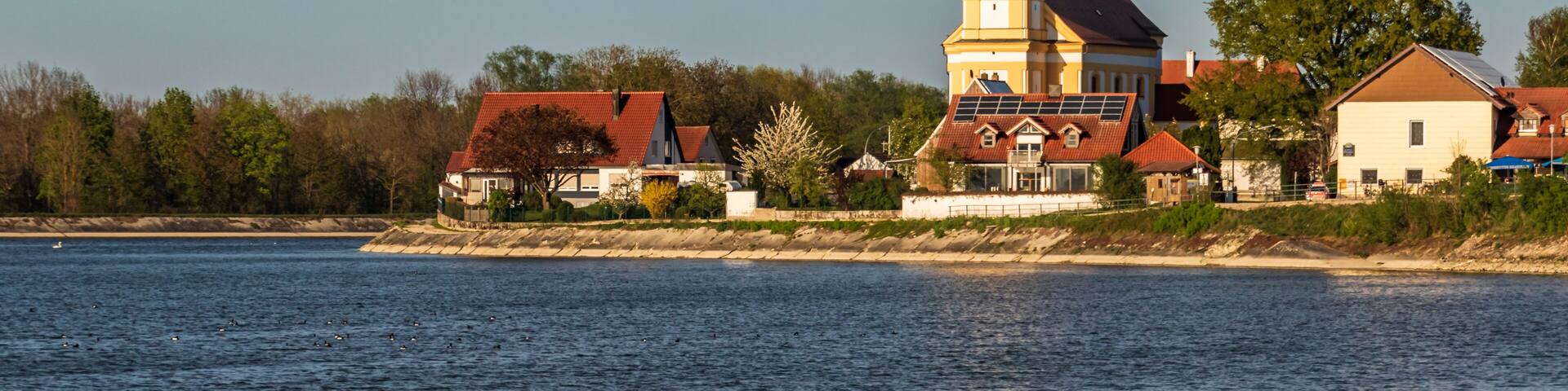 Beautiful view of the church at Eching Stausee - Bavaria - Germany