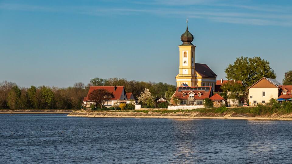 Beautiful view of the church at Eching Stausee - Bavaria - Germany