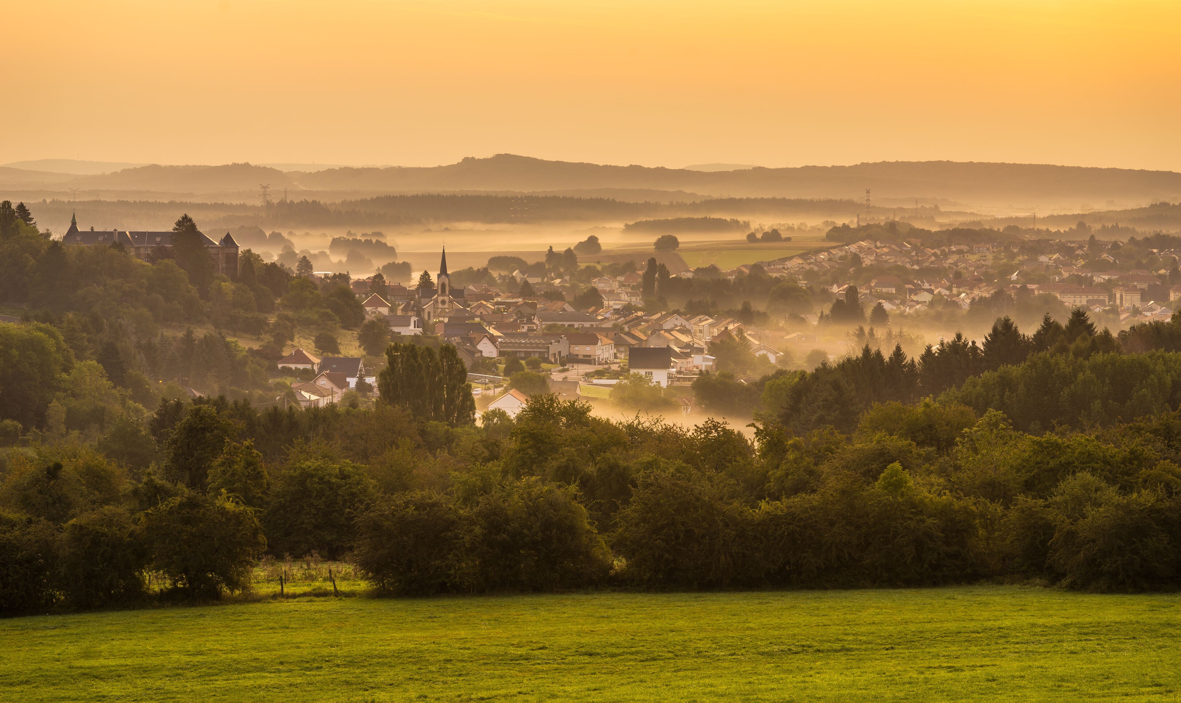 Landscape with the village of Longeville les Saint Avold at sunrise in Lorraine France