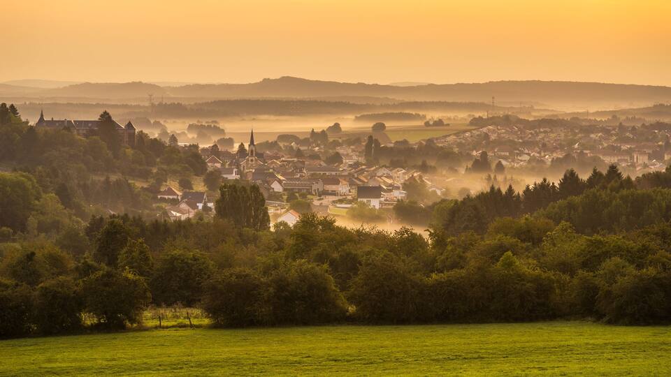Landscape with the village of Longeville les Saint Avold at sunrise in Lorraine France