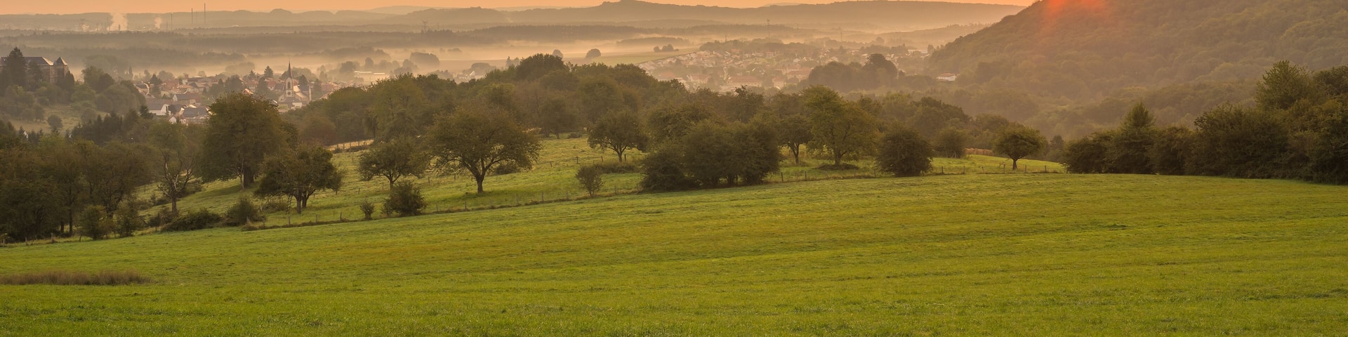 Landscape with the village of Longeville les Saint Avold at sunrise in Lorraine France