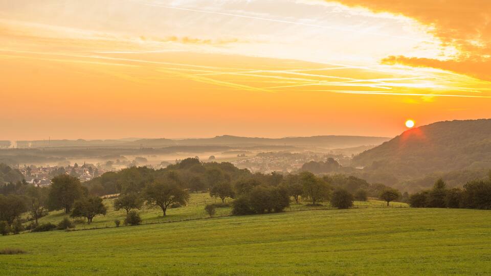 Landscape with the village of Longeville les Saint Avold at sunrise in Lorraine France