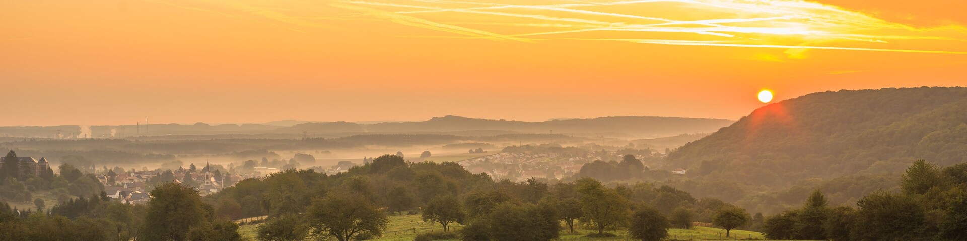 Landscape with the village of Longeville les Saint Avold at sunrise in Lorraine France