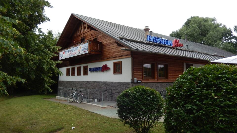 A Bavarian restaurant with a wooden facade and a sign that reads "Bavaria."