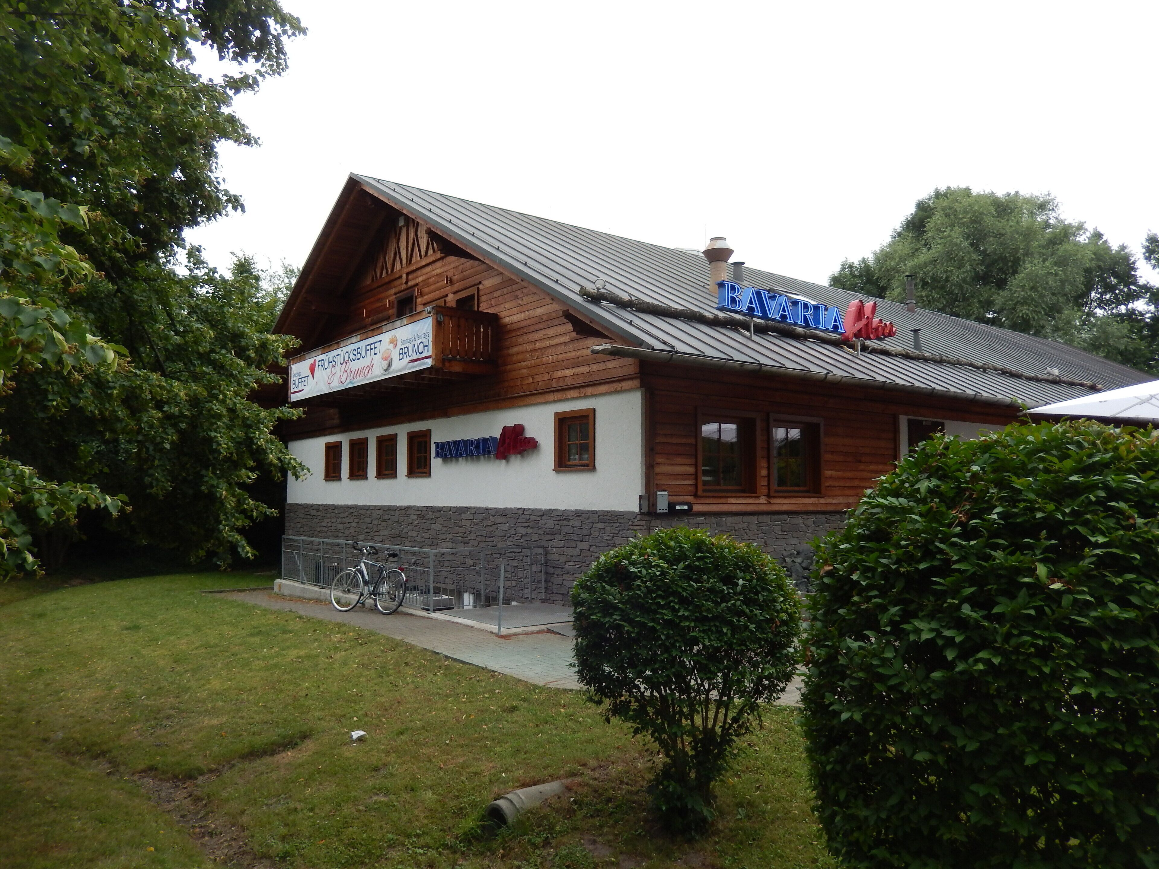 A Bavarian restaurant with a wooden facade and a sign that reads "Bavaria."