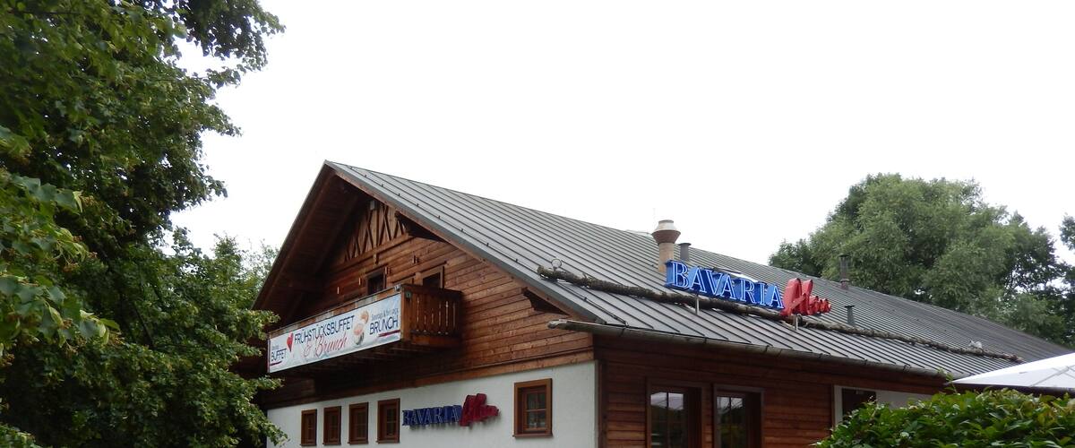 A Bavarian restaurant with a wooden facade and a sign that reads "Bavaria."