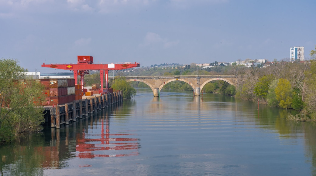 Gennevilliers, France - 04 21 2021: Banks of the Seine. Containers and lifting gear in the Port of Gennevilliers