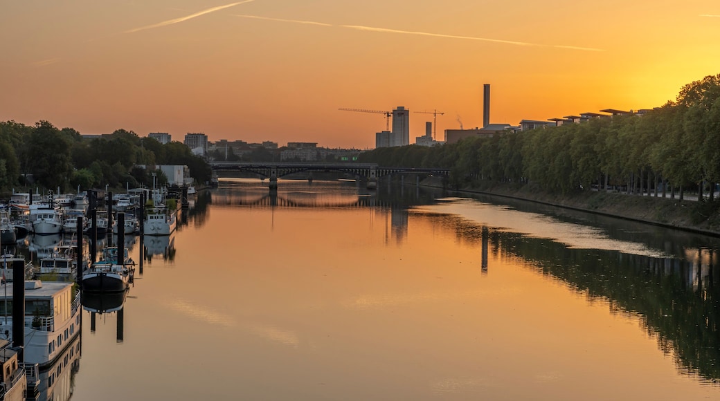 Gennevilliers, France - 05 06 2023: Panoramic view of the Seine river and Saint-Denis district from Clichy bridge at sunrise.