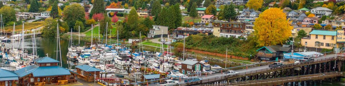 Gibsons which includes a small town or village, a bay or harbor and landscape views