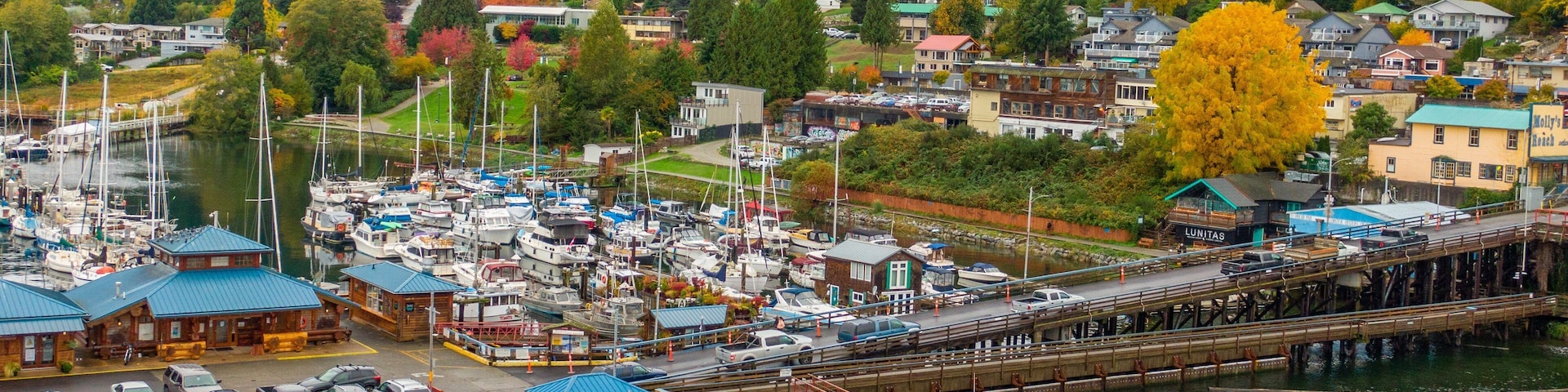 Gibsons which includes a small town or village, a bay or harbor and landscape views