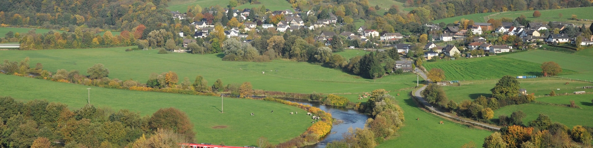 A Class 423 commuter train passes one of the numerous bridges of the Sieg Railway. The train of the S-Bahn Köln is on the way to Düren via Cologne. This image has been taken from the castle ruin Blankenberg which has lookout providing a good view over the valley.