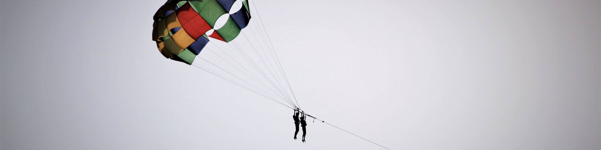 Parasailing silhouette at Miramar beach in Goa, India