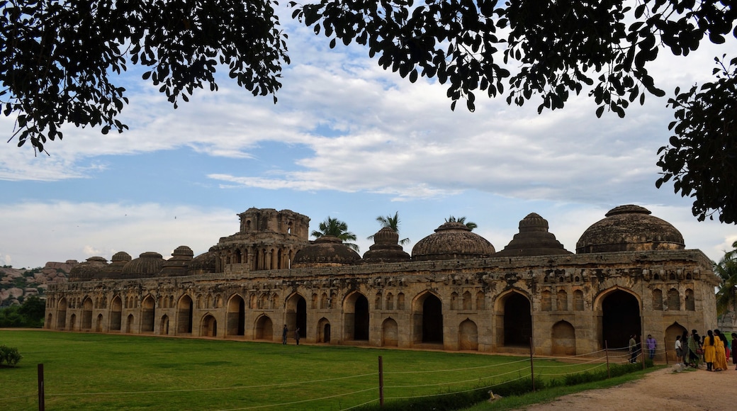 The long and imposing 11 domed stables built for the royal elephants are a part of the Zenana enclosure in Hampi. There are numerous beautiful carvings on each of the grand arches. There is a small secret (no longer) stairway in the central dome to climb to the roof but it's closed for visitors. This is also one of the few well preserved structures in Hampi.