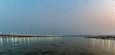 Kumbha Mela, Allahabad, Uttar Pradesh, India; 17-Feb-2019; lights on the river banks, sunset at Sangam, river Ganges