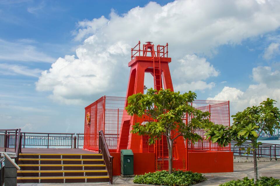 Singapore Nov 17th 2020: The Berlayer Point Lighthouse in Labrador Nature Reserve. Built in 1930, this lighthouse acts as the port (left-hand) side navigation guide for ships approaching the channel.
