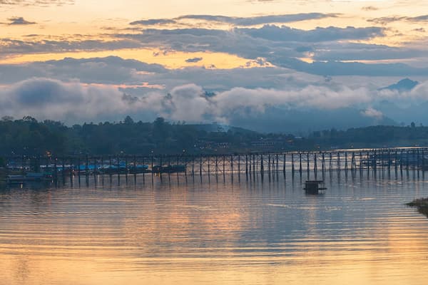 Panorama of beautiful sunrise scene at old an long wooden bridge at Sangklaburi,Kanchanaburi province, Thailand