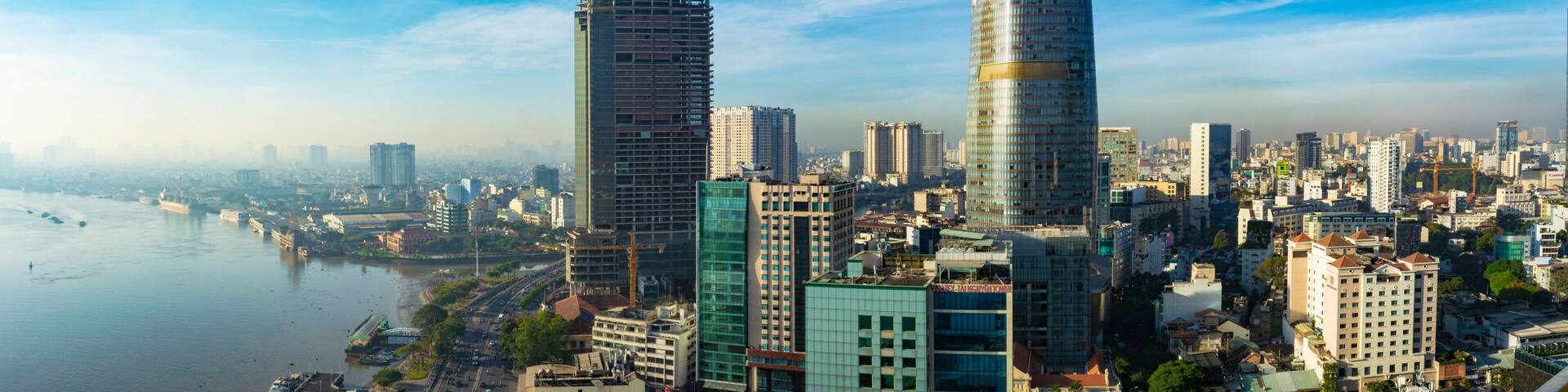 Ho Chi Minh (Saigon) City, Vietnam - CIRCA 2019: Saigon aerial cityscape, showing Saigon River on the left and Bitexco Financial Tower on the right.