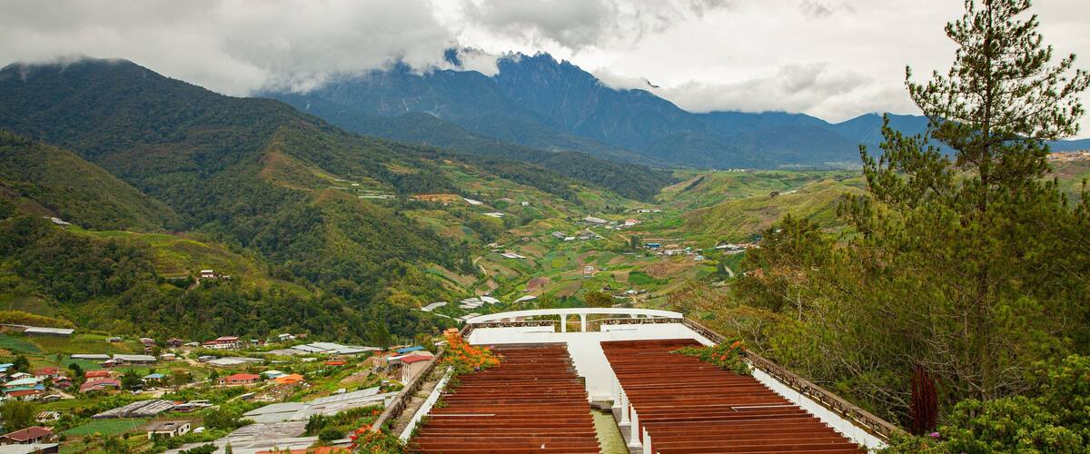 Kundasang War Memorial which includes landscape views, tranquil scenes and a small town or village