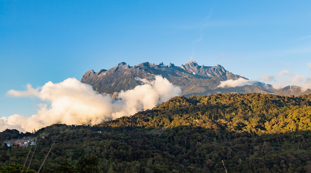 view of Mount Kinabalu emerges out from the clouds at near sunsets