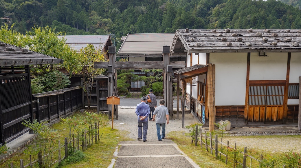 Tsumago Honjin featuring a small town or village as well as a small group of people