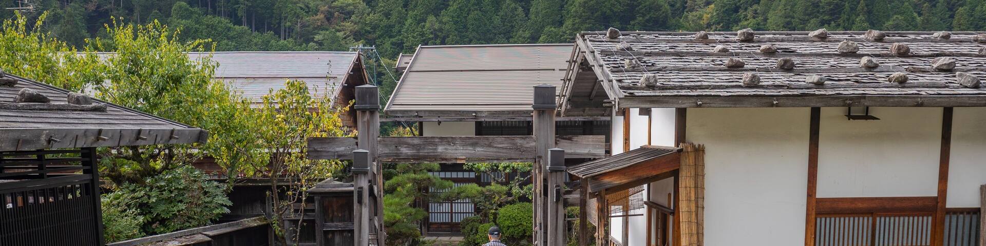 Tsumago Honjin featuring a small town or village as well as a small group of people