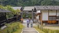 Tsumago Honjin featuring a small town or village as well as a small group of people