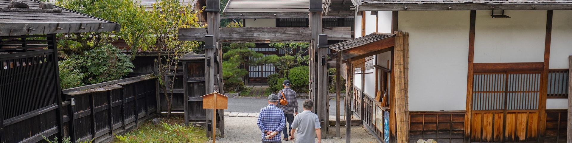 Tsumago Honjin featuring a small town or village as well as a small group of people