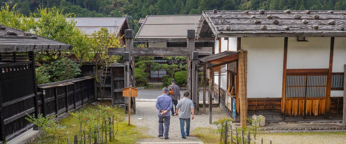 Tsumago Honjin featuring a small town or village as well as a small group of people