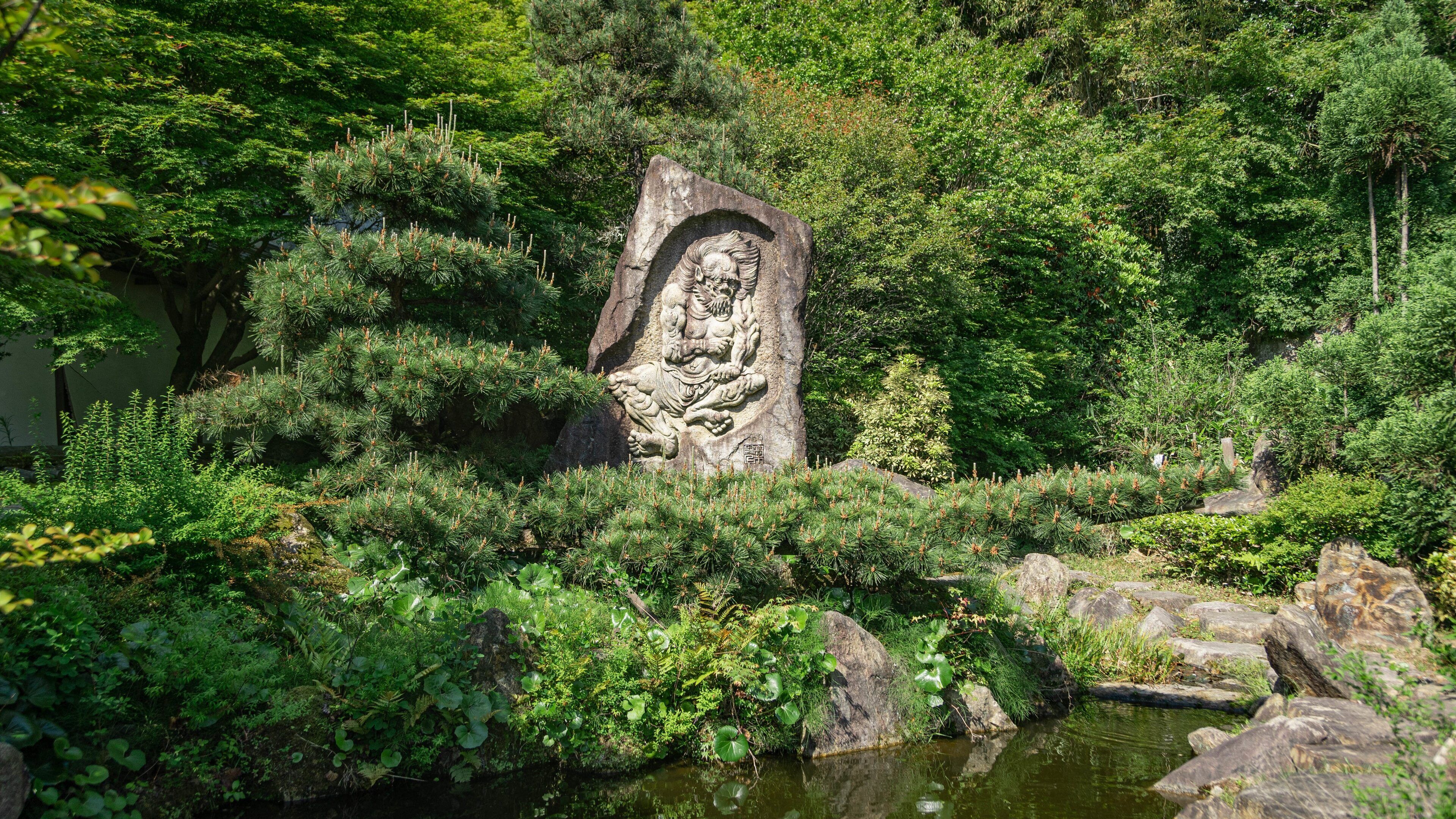Ishiyama-dera showing a pond, heritage elements and a park