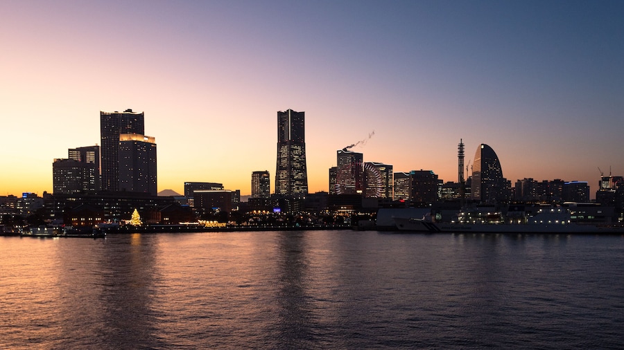 Yokohama, Japan - YOKOHAMA city - MINATOMIRAI twilight cityscape and skyline from the Yokohama bay during sunset from Osanbashi International Passenger Terminal with filtering effect.