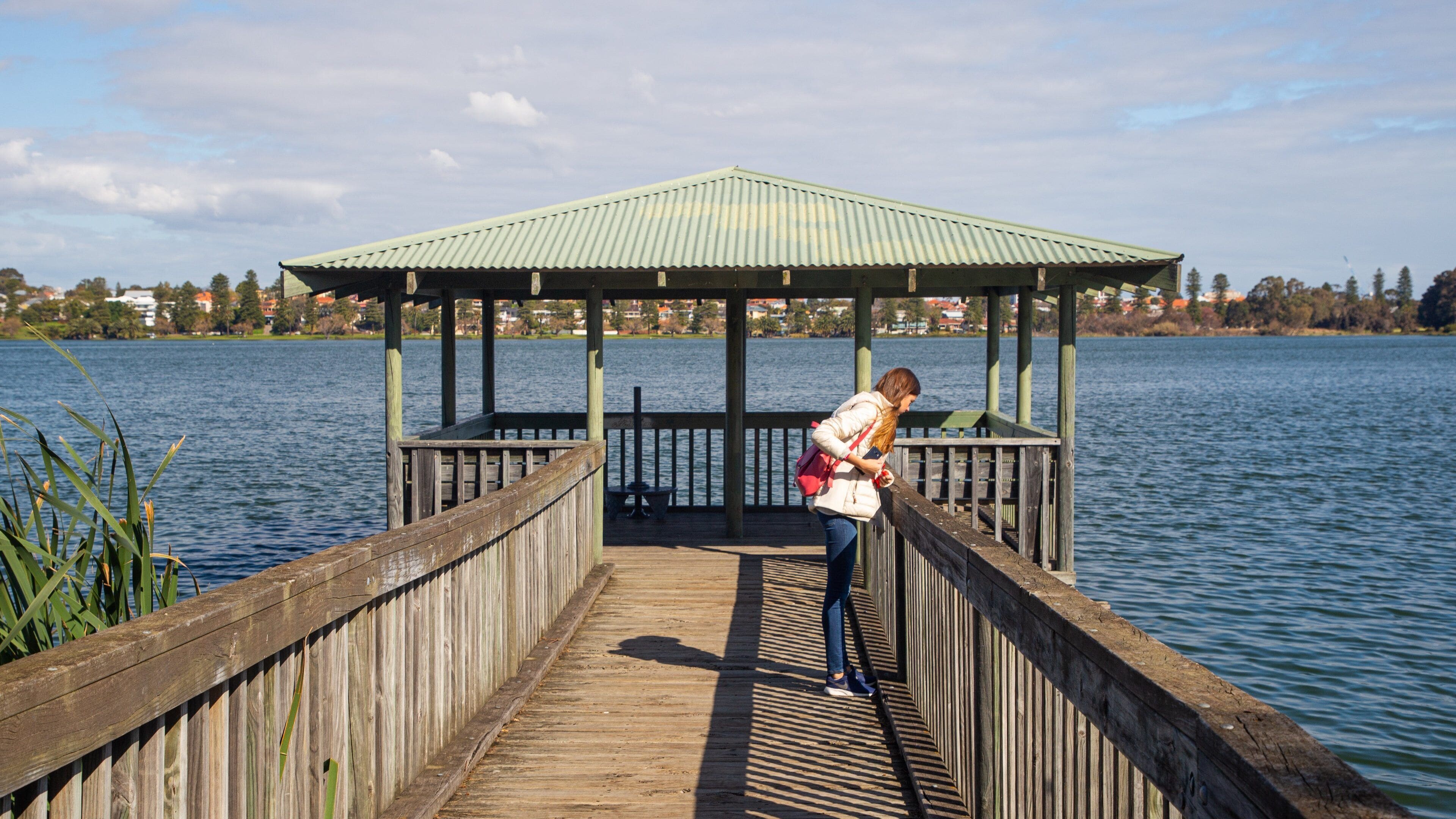 Lake Monger featuring a lake or waterhole as well as an individual femail
