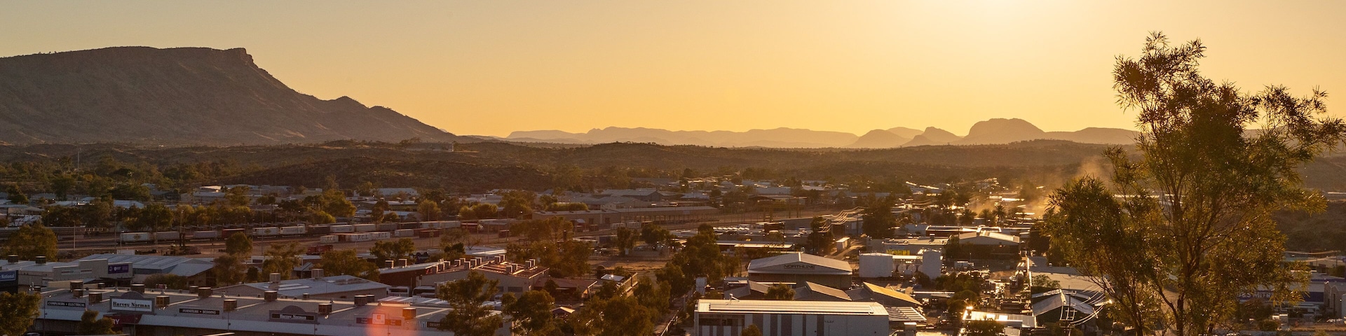 Anzac Hill which includes landscape views, a small town or village and a sunset