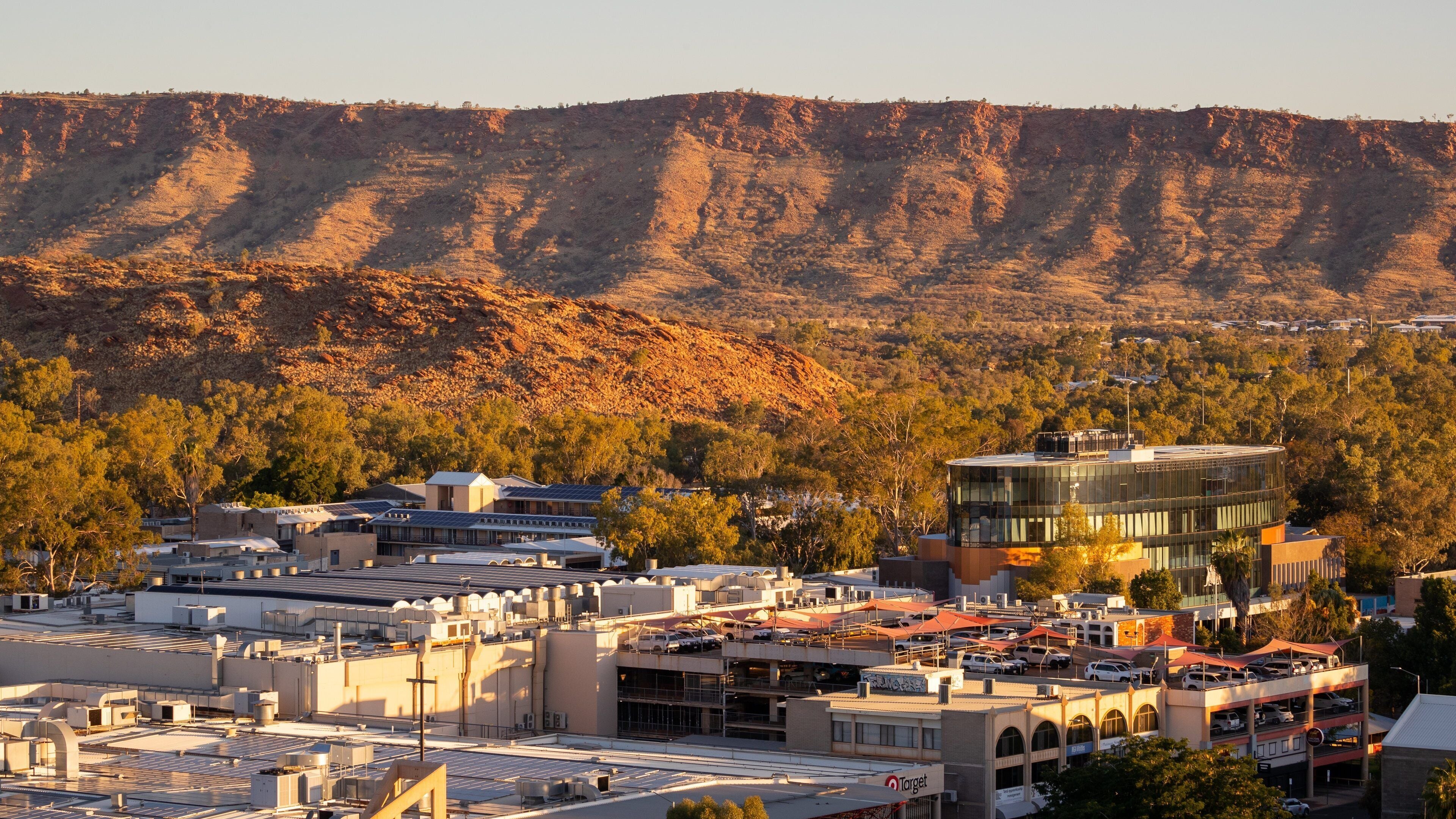 Anzac Hill showing a gorge or canyon, a small town or village and desert views