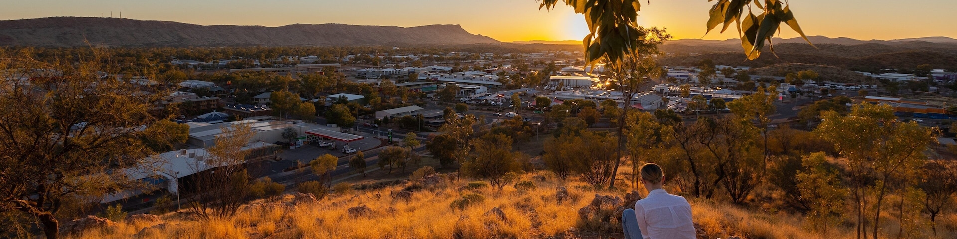 Anzac Hill showing landscape views, a small town or village and a sunset
