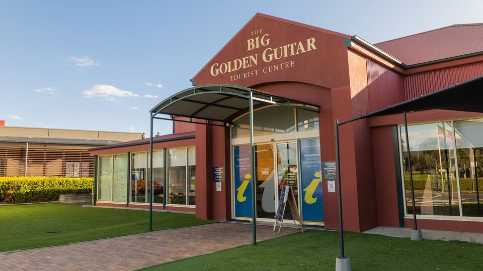 Big Golden Guitar Tourist Centre featuring signage